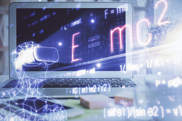 Desktop computer background and formula hologram writing. Double exposure. Education concept.