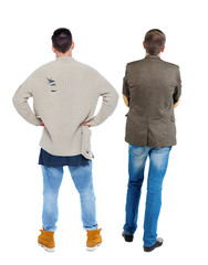 Back view two man in sweater.