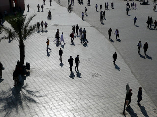 Morocco. Djemaa el Fna square in Marrakech with market in the center
