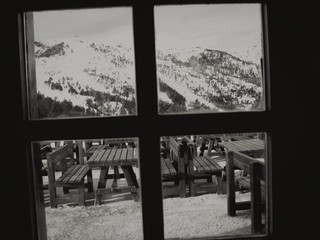 Mountains And Picnic Tables Viewed Through Window