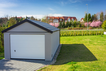 Free-standing garage in the sunny garden