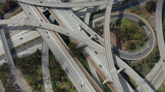 AERIAL: Judge Pregerson Huge Highway Connection showing multiple Roads, Bridges, Viaducts with little car traffic in Los Angeles, California on Beautiful Sunny Day 