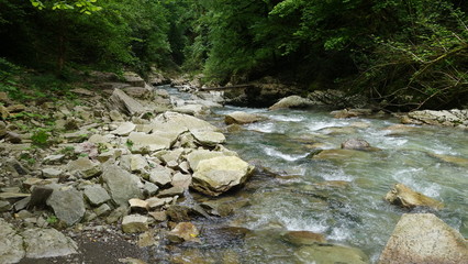 The river in the gorge runs over the stones