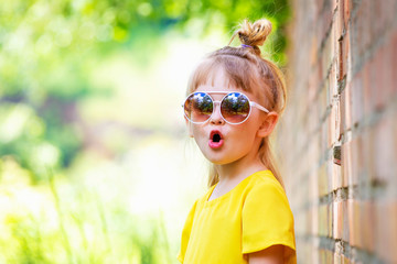 Funny little girl in yellow dress