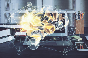 Double exposure of work table with computer and brain sketch hologram. Brainstorming concept.