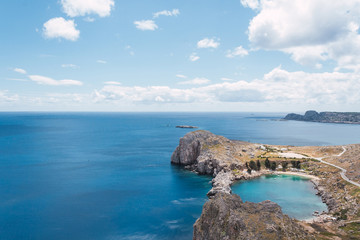 Fototapeta premium A view of the Mediterranean Sea in the Greek island of Rhodes, with a natural salt water pool.