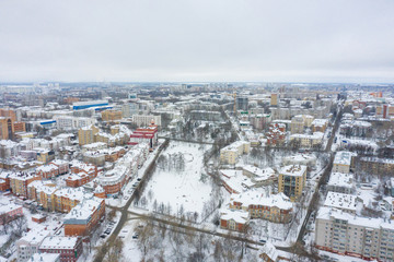 Panorama of the small town and Razderikhinsky ravine in the central part of the city of Kirov on a winter day from above. Russia from the drone.