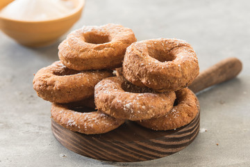 Homemade donuts sugar glazed on a stone background