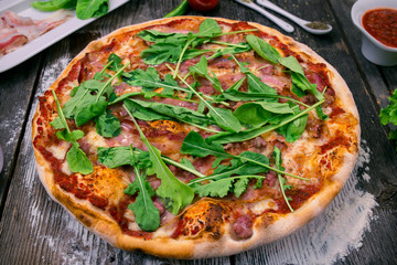 Styled Top View of Large Ham and Rucola Pizza, Food Photography on wooden background table