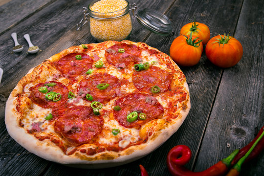Styled Top View of Large Pepperoni Salami Pizza, Food Photography on wooden background table