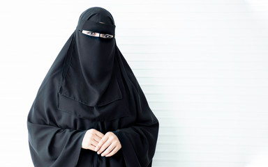 Woman wearing black traditional muslim clothing