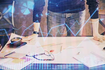 Multi exposure of man standing and planing investment with stock market forex chart.