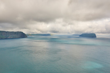 Faroe islands dramatic coastline from helicopter. Faroese archipelago