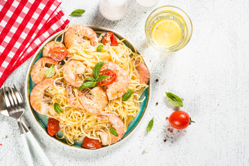 Pasta seafood with shrimp on white table.