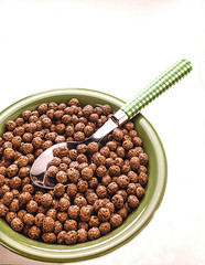 Breakfast cereal in a bowl and a spoonful of appetite