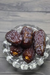 Sweet medjool dates with cup for ramadan kareem
