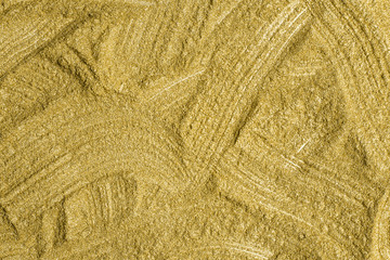 Detailed texture of glittering golden dust surface. Golden Shiny Wallpaper , Perfect for Christmas, New Year or any other Holidays Background. Golden fine powder