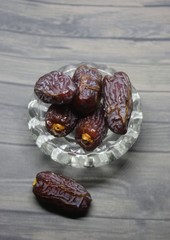 Sweet medjool dates with cup for ramadan kareem