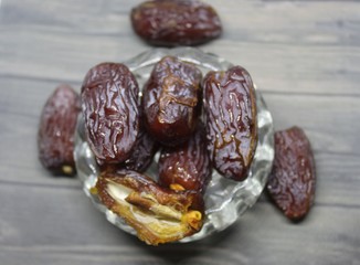 Sweet medjool dates with cup for ramadan kareem