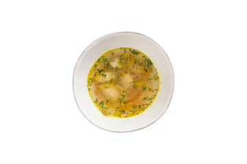 chicken broth with meatballs and herbs in bowl isolated on white background