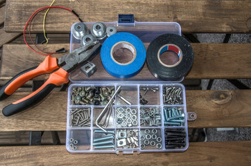 Toolkit - set of instruments: pliers, electrical tape, set of bolts, wires, washers, tape measure, wire cutters.