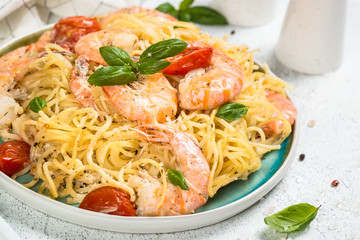 Pasta seafood with shrimp on white table.
