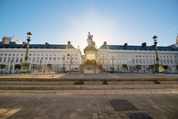 Fototapeta na wymiar Martyrs' Square (Place des Martyrs). Sunrise behind statue. Belgian flag. Brussels, Belgium