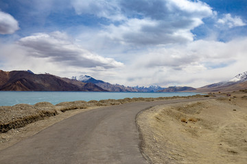 View landscape of Himalayas mountains and Frozen lake Pangong Tso high grassland lake while winter...