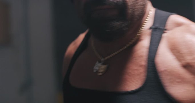 Boxer throwing punches at the camera while training.
