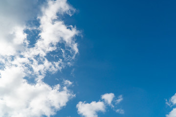 Background nature clear clean blue sky soft clouds beautiful dramatic cloudscape summer sun ray light presents beautiful day life after storm. use as overlay effect or frame with center copy space  