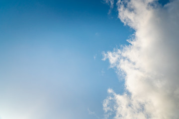 Background nature clear clean blue sky soft clouds beautiful dramatic cloudscape summer sun ray light presents beautiful day life after storm. use as overlay effect or frame with center copy space  