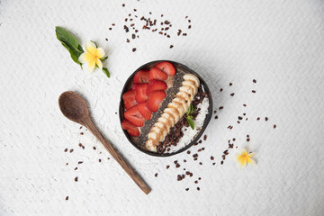 Vegan smoothie bowl with fruits and seeds