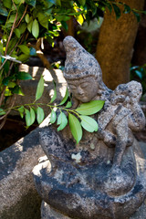stone statue in a garden