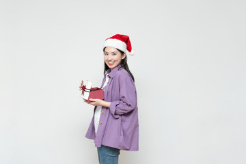 A young asian woman with a gift box in her hand