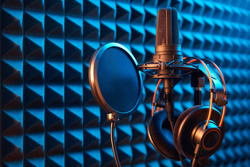 Studio condenser microphone with professional headphones and pop-up filter