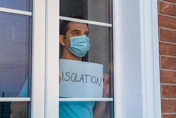Man in a medical mask holds a tablet - ISOLATION