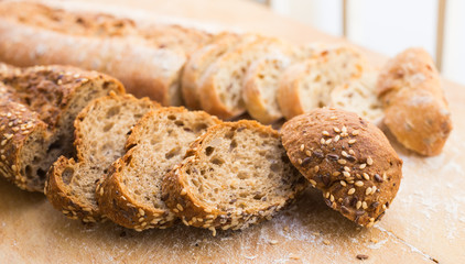 fresh loaf of bread on wooden board