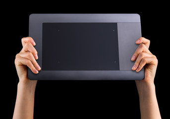 Hand holding graphic tablet for illustratorsand designers isolated on black
