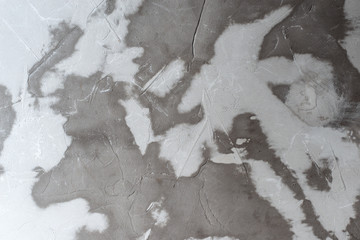 grey textured background with a mineral surface and strong relief