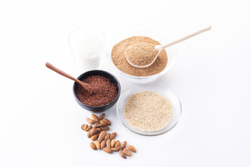 fiber, coconut, almonds and seeds of red and white quinoa on a white background