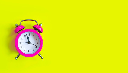alarm clock on a colored background