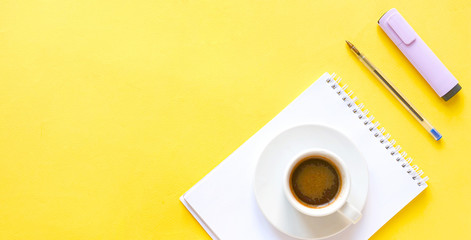 Obraz na płótnie Canvas flat lay composition with notebook, pen, coffee, plant on yellow background. Concept remote study and work at home, telework, freelance, quarantine. Distance online learning. Copyspace, banner