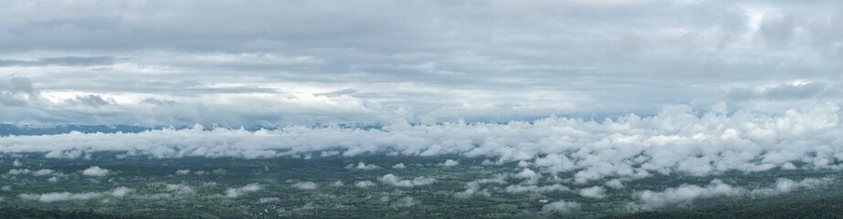Fototapeta premium Panoramic of the rainy season with foggy at morning