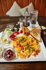 Table setting with breakfast meal presentation photo. Restaurant interior furniture background
