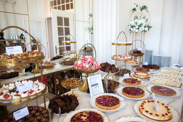 Delicious candy bar with macaroons, cakepops, cupcakes and other sweets