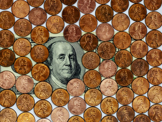 One cent coins frame and $ 100 note