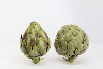 Obraz premium 2 isolated artichokes on a white background s