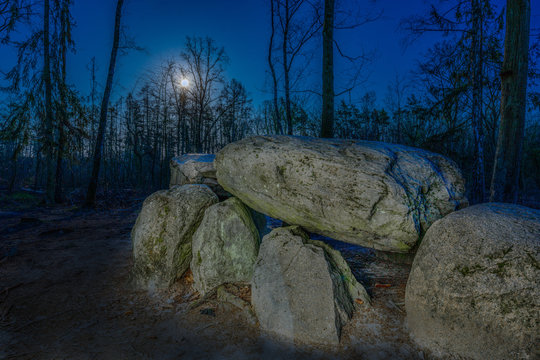 Prehistoric megalith dolmen Teufelskueche (devils kitchen) with full moon
