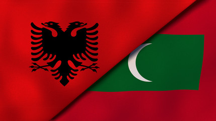 The flags of Albania and Maldives. News, reportage, business background. 3d illustration