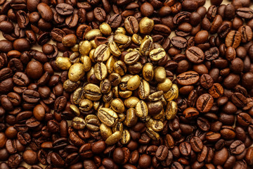 Golden and brown coffee grains on brown paper